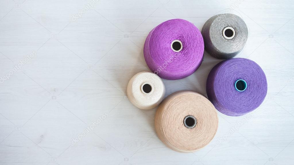 skeins of wool on background gray wood