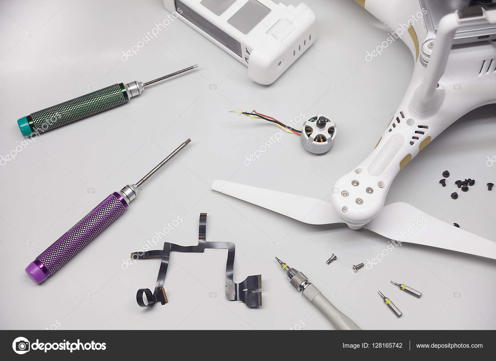 Mounting drone, screws, screwdrivers, propellers, parts Stock Photo by