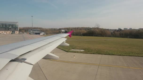 Airplane is taking off from asphalt runway of airport. — Stock Video