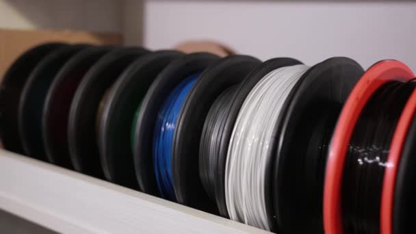 Spools with a plastic thread cable for color printing 3D printer technology — Stock Video