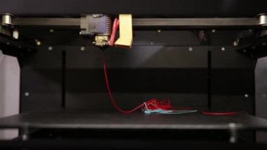 3D technology the printer prints part from plastic cable thread close up.