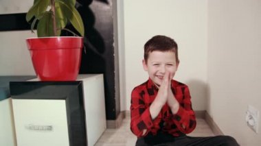 cute guy shirt rubs his hands, shoves an electric plug into an outlet