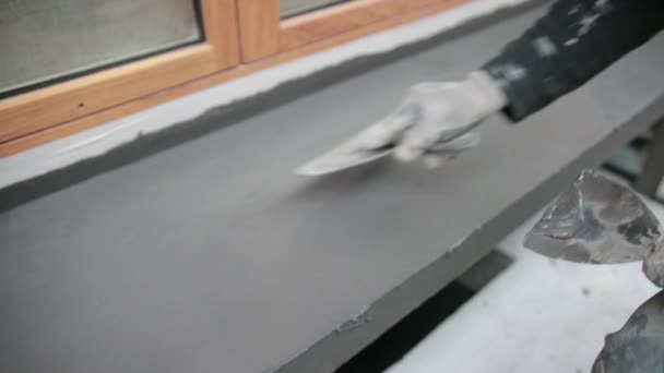 Builder In Protective Glove Smoothly Applies Spatula Solution, Window Sill. — Stock video