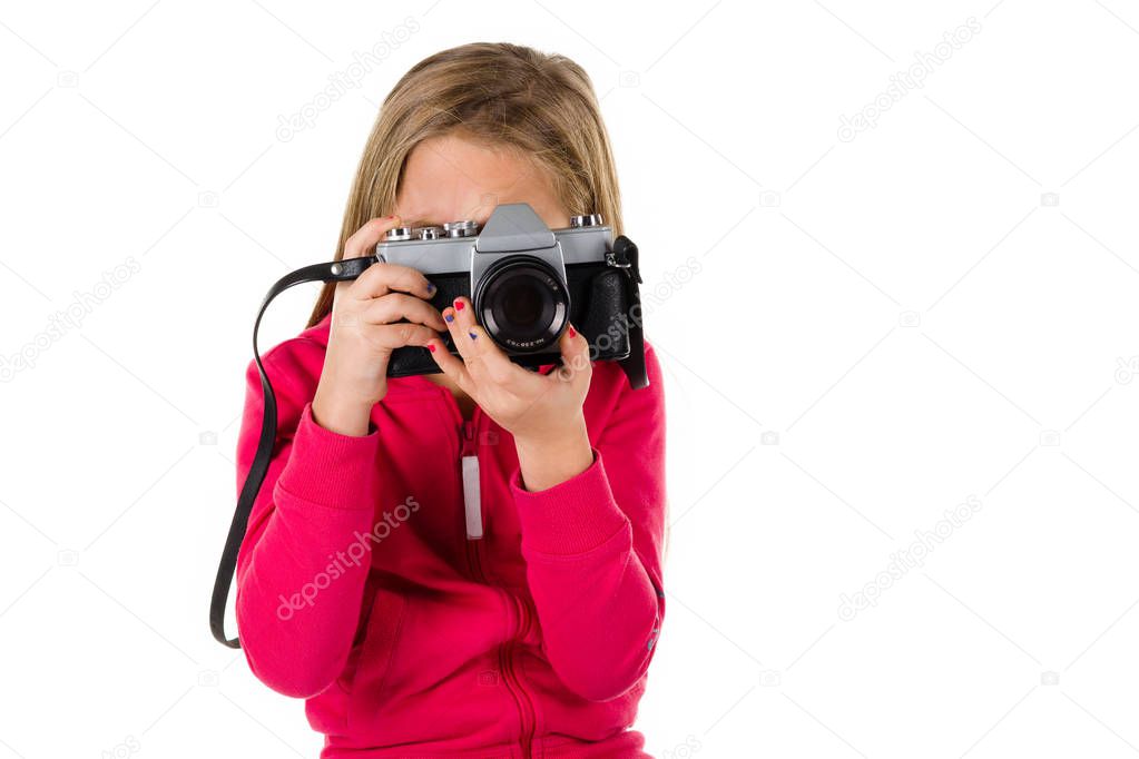 Girl with vintage camera isolated on white