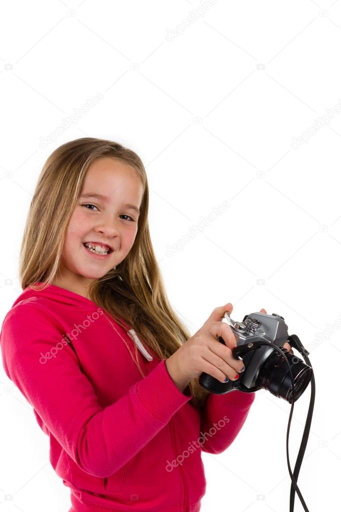 Girl with vintage camera isolated on white