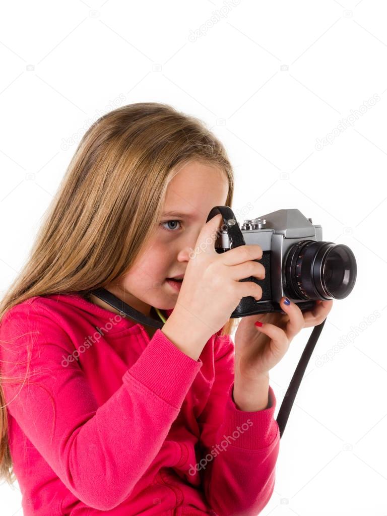 Girl with vintage camera isolated on white background