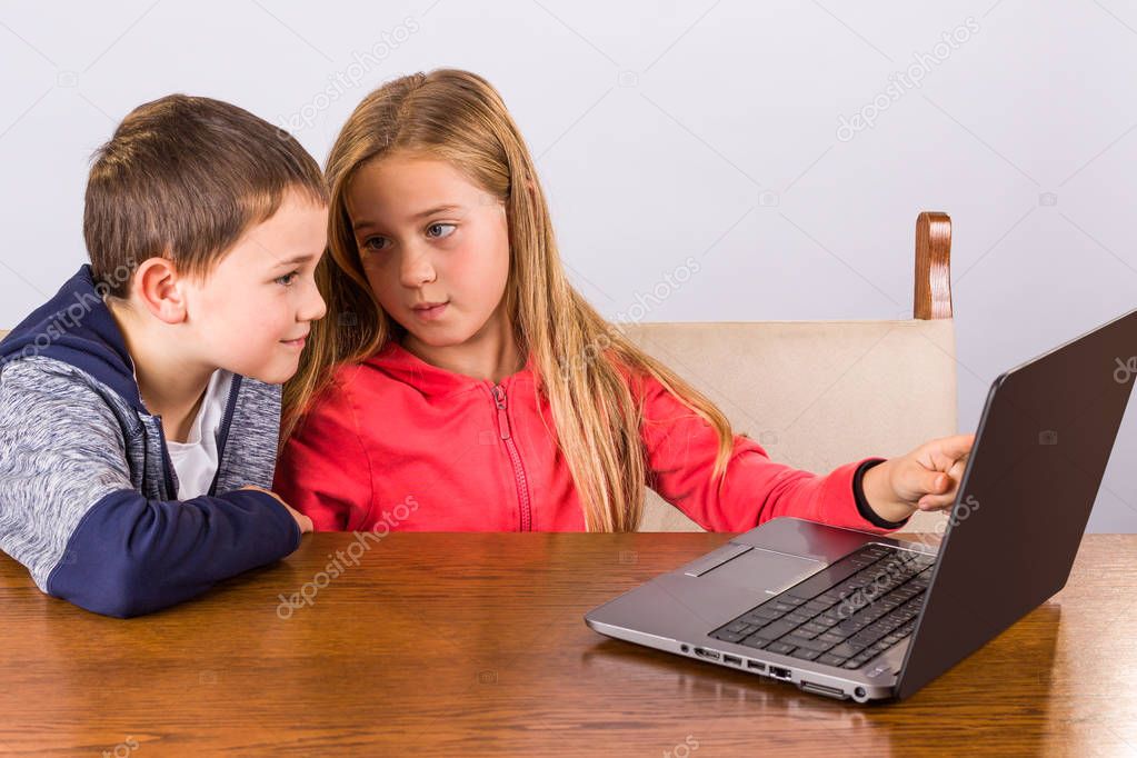 Boy and girl with laptop