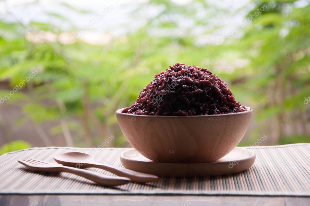 Food. Organic rice. purple rice organic in Thailand. Organic rice in wooden bowl.