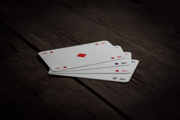 Beautiful image of four aces on a wooden table — Stock Photo, Image
