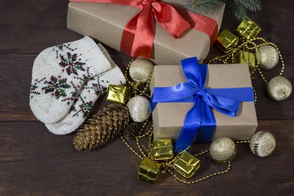 Boxes with gifts, socks with a pattern, cones, golden beads, dec