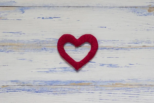 Red heart handmade on a white wooden background Stock Picture