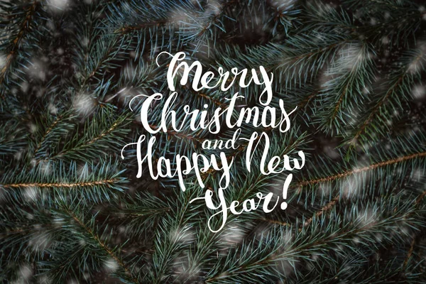 Inscription of Merry Christmas and Happy New Year on a backgroun — Stock Photo, Image