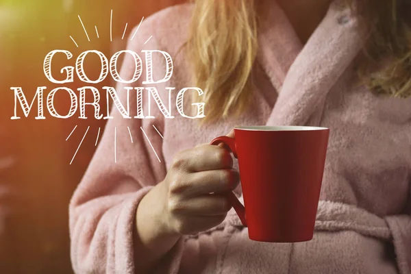 Red cup in the hands of a girl. Added an effect. Good morning in — Stock Photo, Image