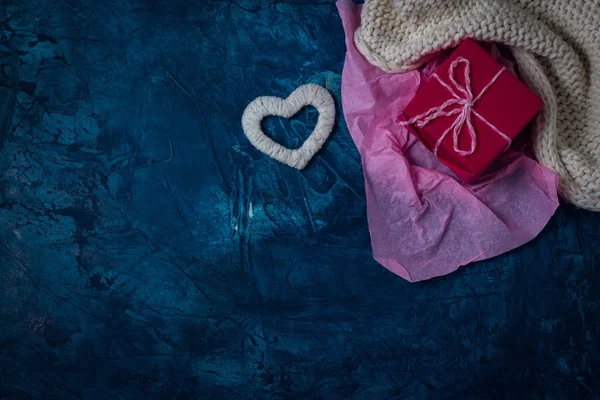 White Scarf and White Heart, Pink Gift, Pink Paper on a Darkly B