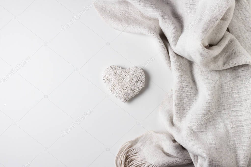 White Scarf and Heart Handmade on a White Background. Concept fo