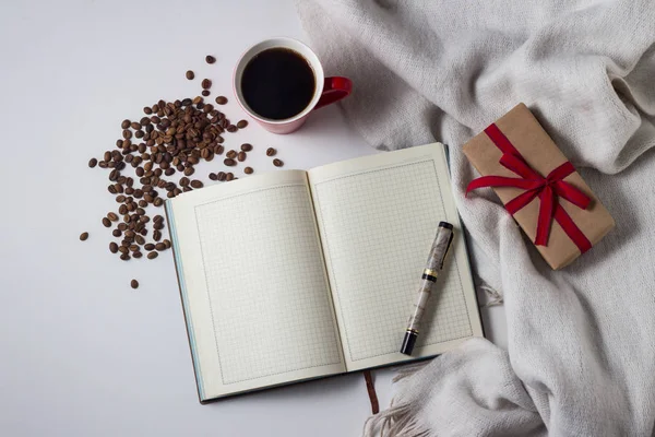 White Scarf, Diary, pen, Gift, Red cup with coffee and coffee gr