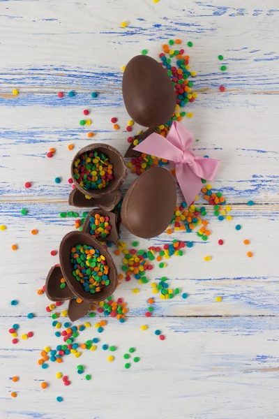 Easter Chocolate Eggs, Multicolored Sweets on the White Wooden B