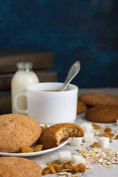 Oatmeal cookies, Books, Oatmeal Flakes, Cup of Coffee with Milk,