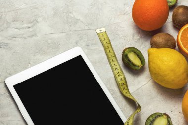 Portakal, limon, kivi, Tablet, taş Backgro kasette ölçme