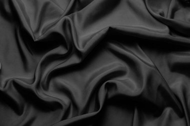Siyah ipek güzel dalgalar ile. Arka plan olarak kullanılabilir veya 