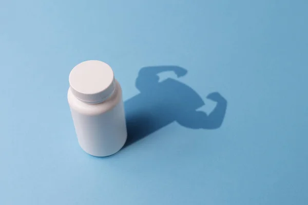 Plastic Bottle with Tablets and the Shadow with the Hands of the — Stock Photo, Image