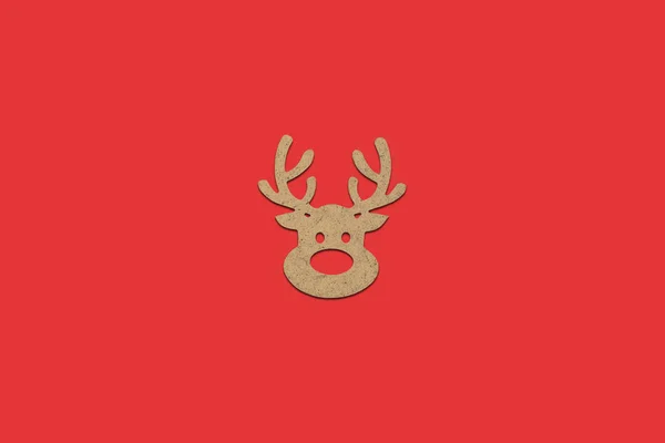 Wooden Christmas toy Deer head on a red isolated background. Mer — Stock Photo, Image