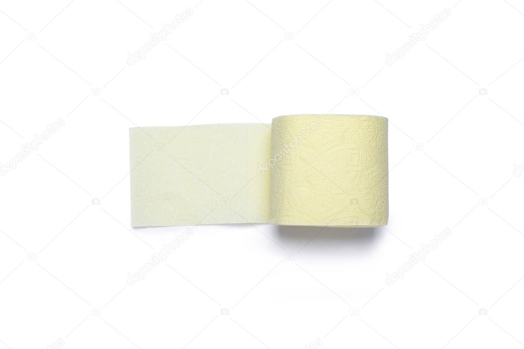 Roll of yellow toilet paper on a white background. Personal hygiene concept. Flat lay, top view