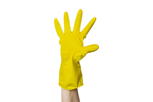 A female hand in a yellow rubber glove for cleaning shows a gesture on a white isolated background. Five fingers — Stock Photo, Image