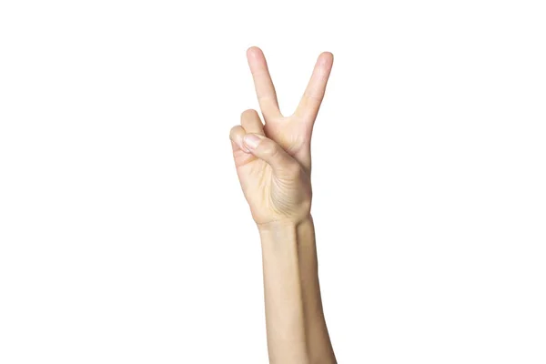 Tangan wanita menunjukkan gerakan pada latar belakang putih yang terisolasi. Dua jari ke atas. Nomor dua — Stok Foto