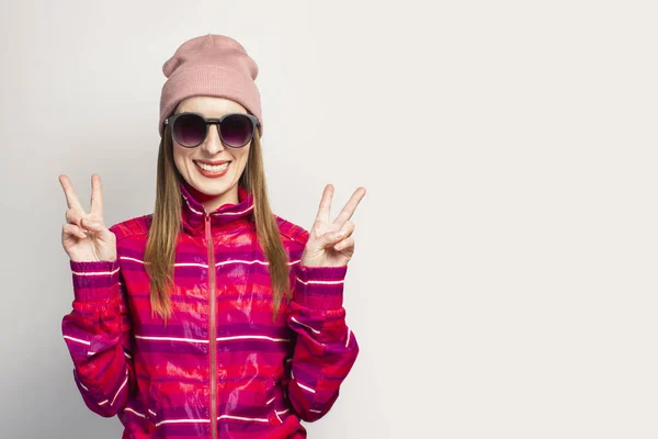 Friendly Emotional Young Woman Glasses Hat Pink Sports Jacket Smile — Stock Photo, Image