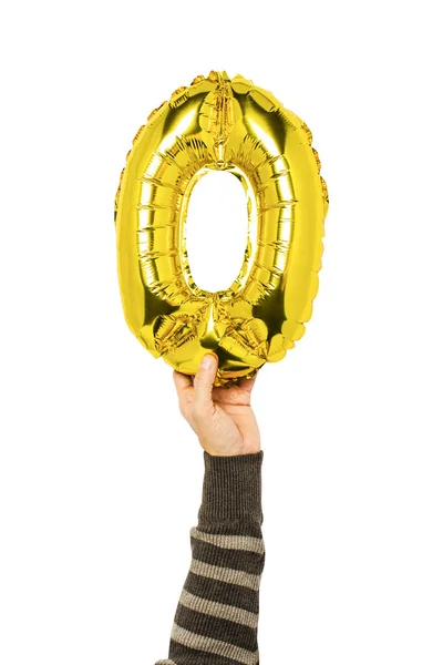 Een Hand Kleding Houdt Een Lucht Gouden Ballon Een Nul — Stockfoto