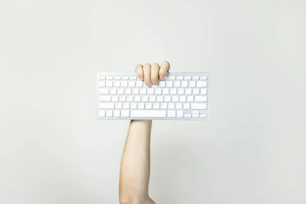 Male Hand Holds Keyboard Light Isolated Background Technology Concept Computer — Stock Photo, Image