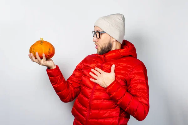 Shocked Young Man Red Jacket Hat Holds Pumpkin Holds His — Stock Photo, Image