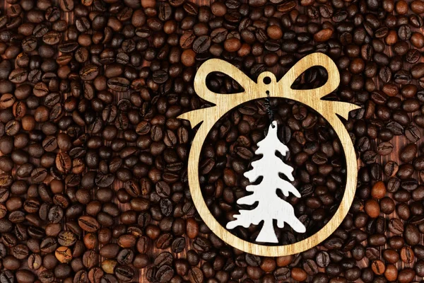Christmas tree toy on the background of coffee beans — Stock Photo, Image