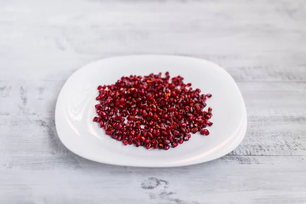 Garnet. Fresh pomegranate on an ecological table. Pomegranate seeds