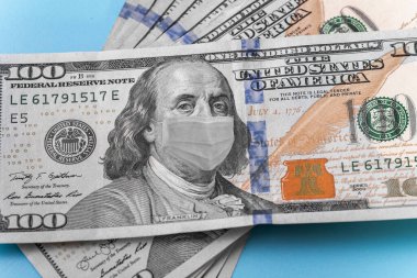 Ben Franklin 'in bir dolarlık banknotta maske takarken çekilmiş bir fotoğrafı. Dünyada ve farklı ülkelerin ekonomisinde sorunlar gösterir