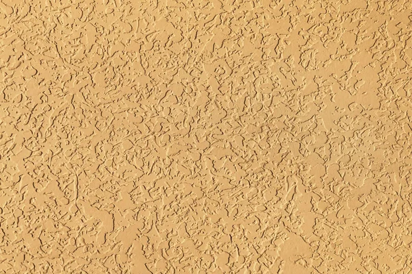 Surface en stuc beige par une journée ensoleillée sur la façade du bâtiment. Résumé, tendance, moderne, fond de texture avec espace de copie . — Photo