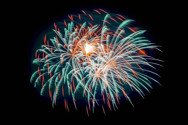 Festive explosion of red and blue fireworks in the dark sky during a celebration. Christmas, New Year, Independence Day, Valentine\'s Day, birthday greeting card concept.