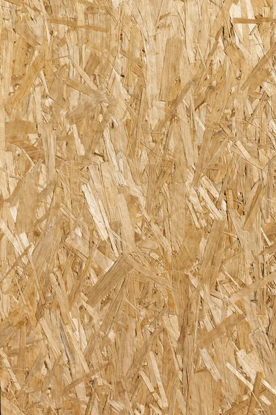 Superficie di posa piana di un truciolato di legno. Struttura verticale del legno. OSB - scheda filiera orientata. Astratto sfondo in legno . — Foto Stock