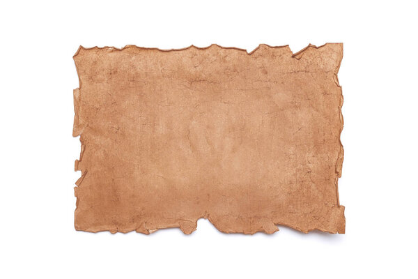 Ancient antique medieval damaged sheet of paper or parchment with ragged crumpled edges with copy space for text isolated on white background.