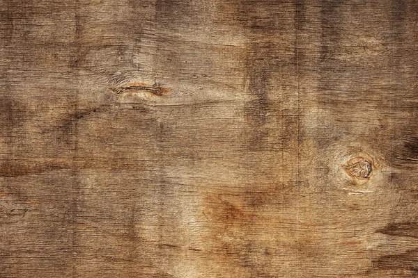 Vista superior sobre la superficie de una vieja tabla de madera marrón manchada. Fondo moderno abstracto de textura de madera de moda — Foto de Stock