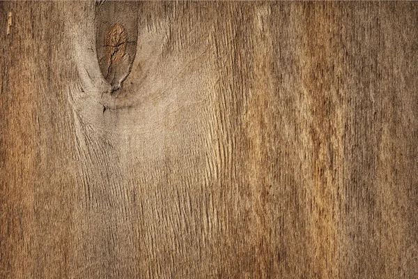 Plano yacía una vieja plancha de madera marrón manchada con un nudo. Fondo moderno abstracto de textura de madera de moda — Foto de Stock