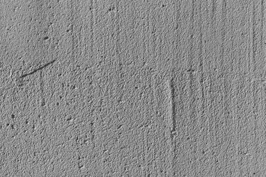 Gri, sert beton bir duvarın yakın yüzeyi. Soyut moda modern çimento dokusu arkaplanı