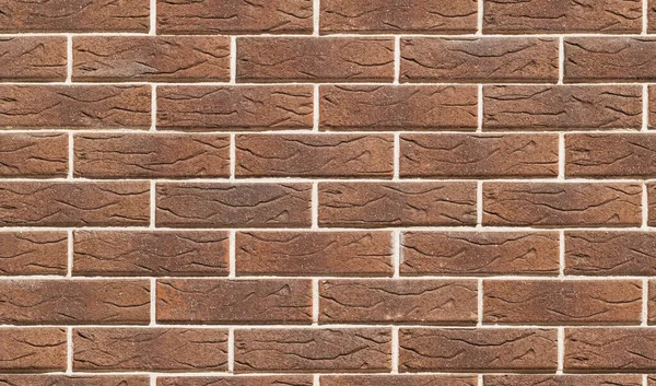 Closeup wall of brown decorative brick. Seamless pattern. Abstract modern brick texture background