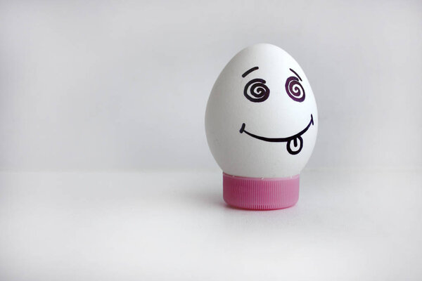 Egg cheerful with face concept of showing tongue