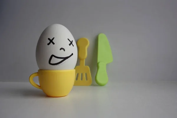 Eggs with face. Concept of early breakfast — Stock Photo, Image