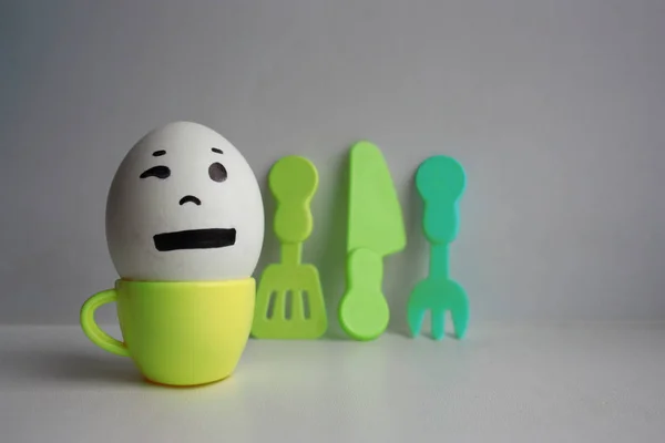 Eggs with face. Concept of early breakfast — Stock Photo, Image