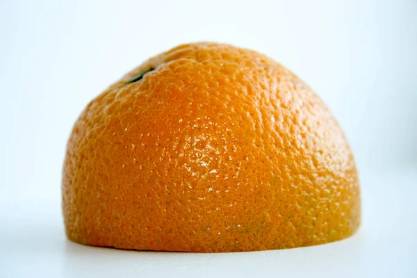 Orange sliced half on the surface. On white background — Stock Photo, Image