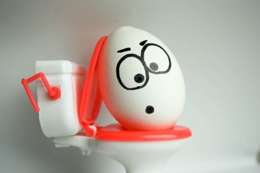 diarrhea is a comical concept. an egg with clipart