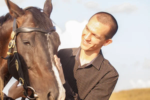 Guy walk. Horse ride Black horse